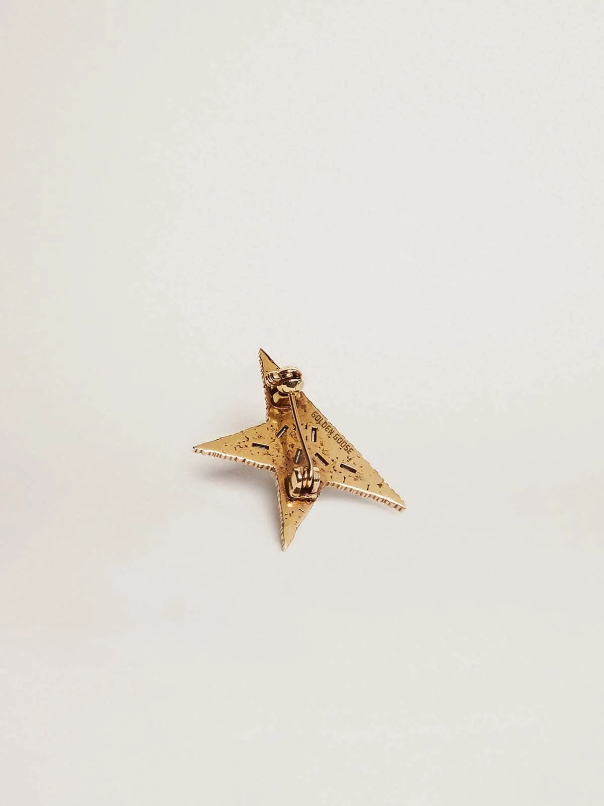 Broche color oro viejo con cristales aplicados para mujer