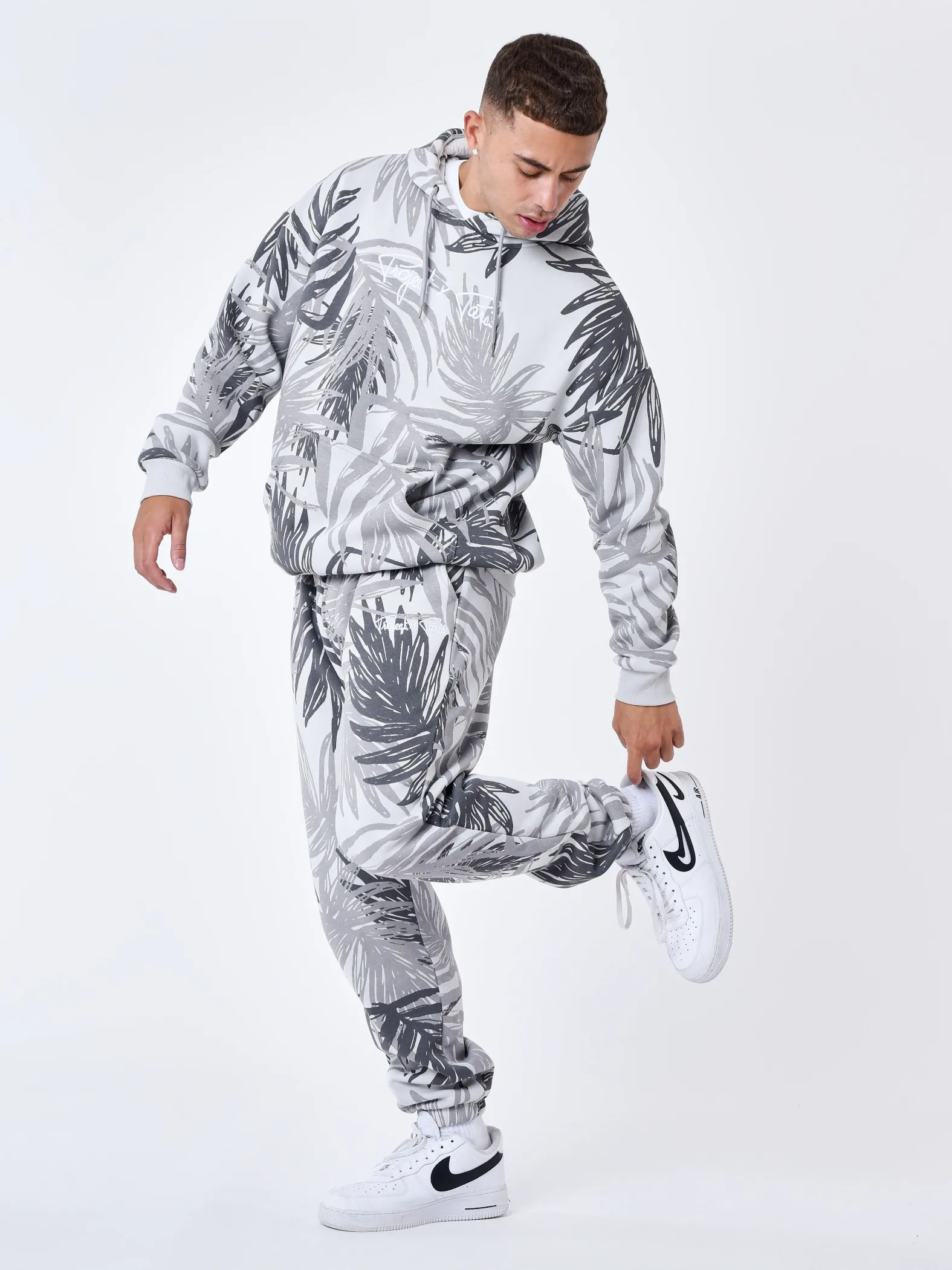 Pantalón de chándal con estampado integral de hojas de palmera