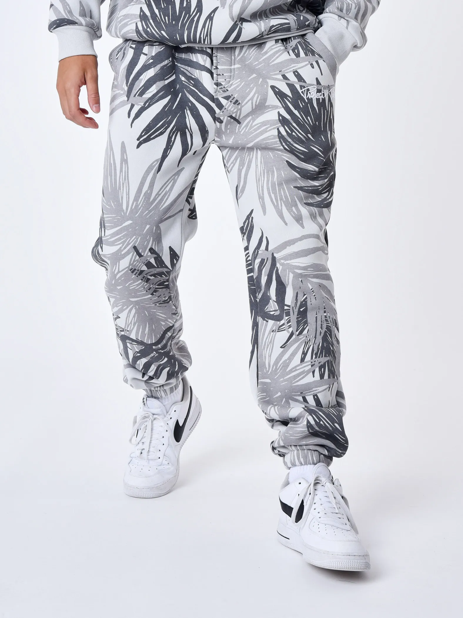 Pantalón de chándal con estampado integral de hojas de palmera