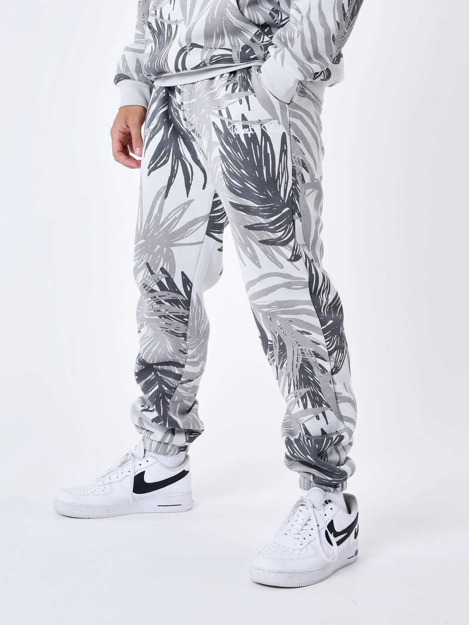 Pantalón de chándal con estampado integral de hojas de palmera